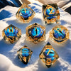 Dice- 7 Resin Dice Gold w/ Blue eye for Role-Playing Games, MTG Tabletop Games